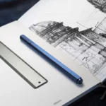 Stilform ARC gel pen made of titanium - gel pen in blue in notebook