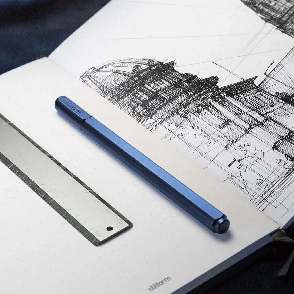 Stilform ARC gel pen made of titanium - gel pen in blue in notebook