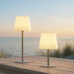 Kreafunk table lamp Arc activated on a beach