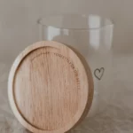Storage jar with heart motif from the brand Eulenschnitt made of glass with wooden lid