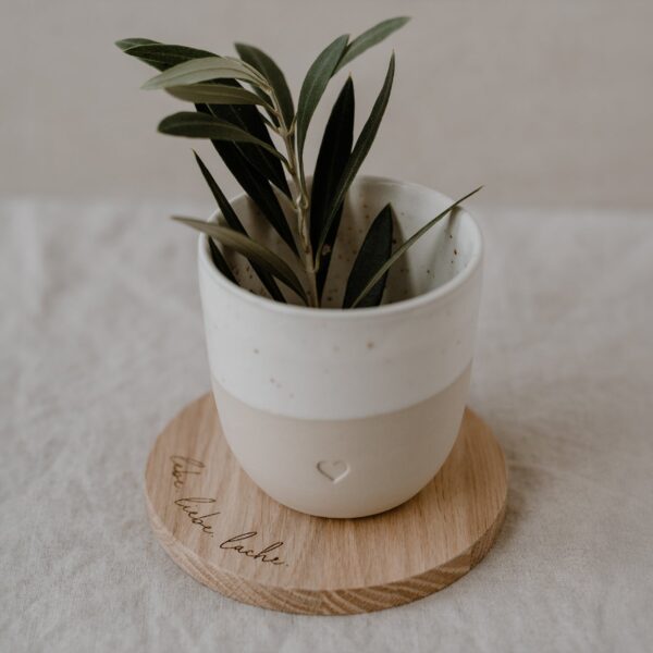 Owl cut coaster made of oak with the saying Lebe. Love. Laugh.