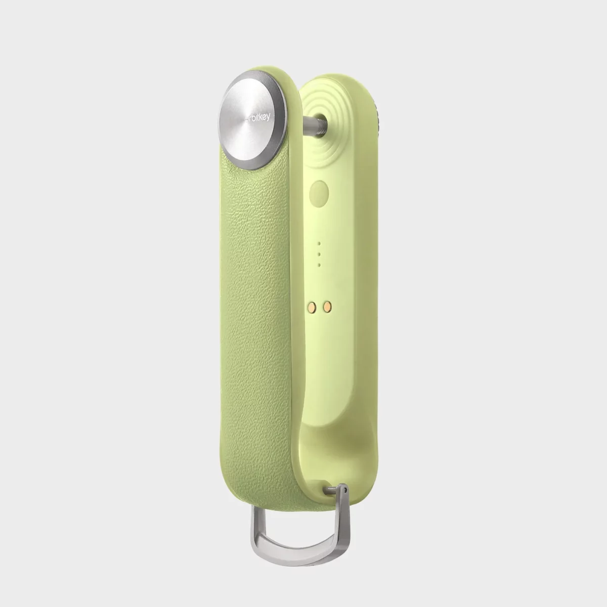 Orbitkey Key Organiser Tracker in Citrus, Seitenansicht auf das Tracker-Modul mit magnetischen Ladekontakten
