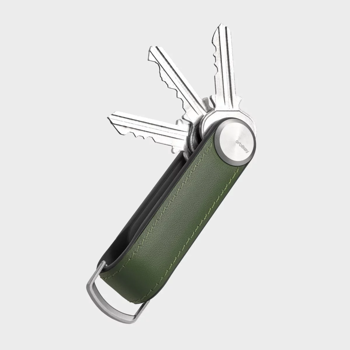 Orbitkey Key Organiser Tracker aus Leder in Waldgrün, geöffnet mit drei aufgefächerten Schlüsseln