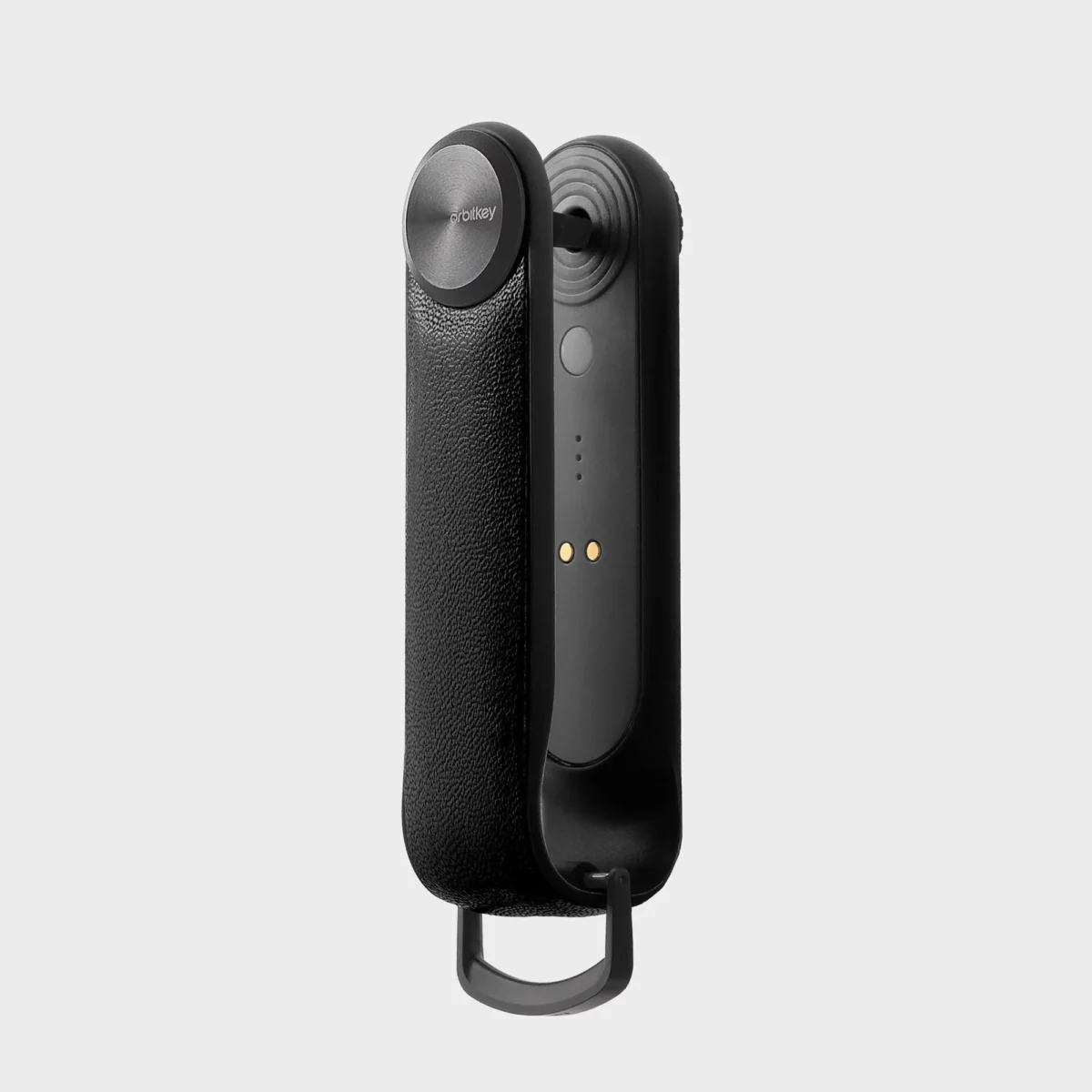 Orbitkey Key Organiser Tracker in Schwarz, Seitenansicht auf das Tracker-Modul mit magnetischen Ladekontakten