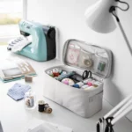 Yamazaki TOWER Storage Bag with Dividers in Gray, with a sewing kit next to the sewing machine