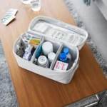 Yamazaki TOWER Storage Bag with Dividers in Gray, shown from above with medications in three compartments