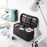 Yamazaki TOWER Storage Bag with Dividers in Black, with a sewing kit next to the sewing machine