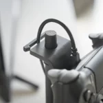 Yamazaki SMART 3-Tier Controller Stand in Black, close-up of the clip that holds the charging cable