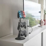 Yamazaki SMART 3-Tier Controller Stand in Black, next to the console with three controllers