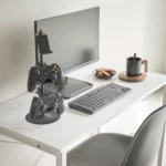 Yamazaki SMART 3-Tier Controller Stand in Black, on the desk next to the monitor and keyboard