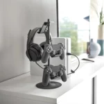 Yamazaki SMART 3-Tier Controller Stand in Black, on the sideboard with a headset and two controllers