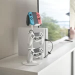 Yamazaki SMART 3-Tier Controller Stand in White, next to the console with three controllers