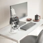 Yamazaki SMART 3-Tier Controller Stand in White, on the desk next to the monitor and keyboard