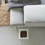Yamazaki TOWER Food Bowl, single, with stand in white, shown from above next to the sofa with food in the bowl
