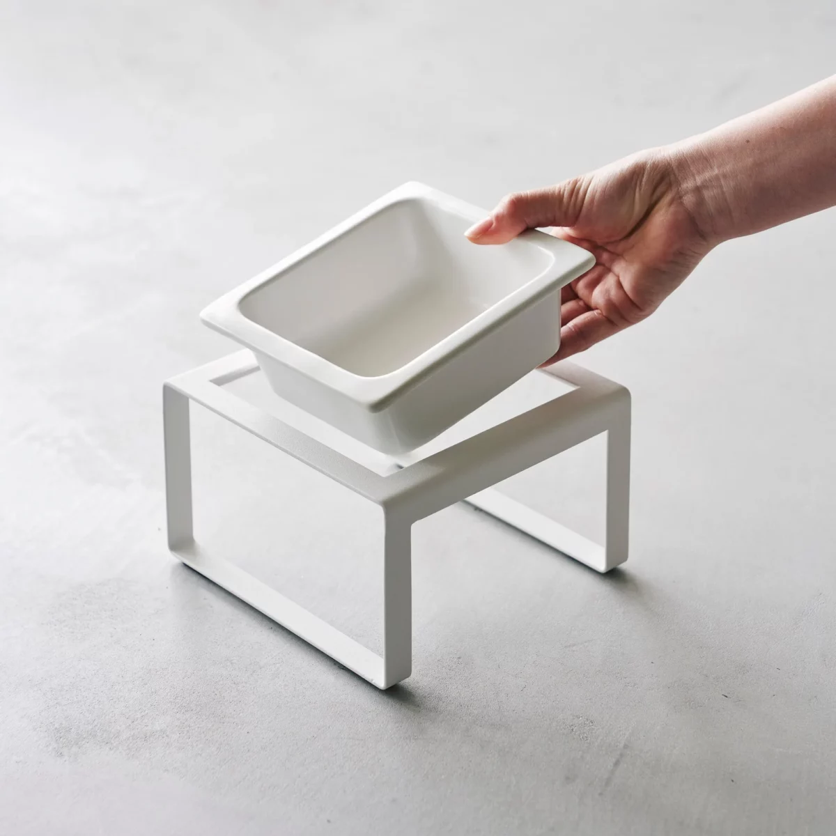 Yamazaki TOWER Food Bowl, single, with stand in white; the ceramic bowl lifts out of the stand by hand