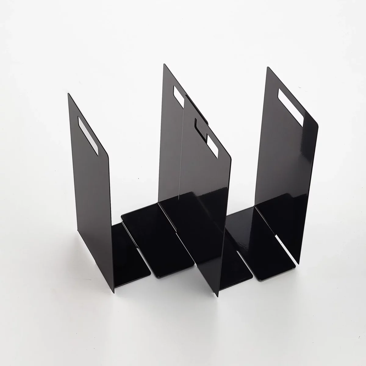Yamazaki TOWER Towel Storage, 2-Piece Set in Black, with two units arranged in a staggered configuration to accommodate different shelf widths