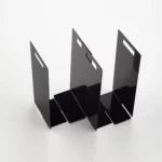 Yamazaki TOWER Towel Storage, 2-Piece Set in Black, with two units arranged in a staggered configuration to accommodate different shelf widths