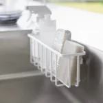 Yamazaki TOWER Film Hook multi-use basket L in white, close-up with sponges in the basket