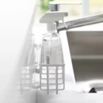 Yamazaki TOWER Film Hook multi-use basket L in white, close-up from the side with a spray bottle