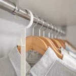 Yamazaki SMART 2-Tier Extendable Clothes Rod in White, close-up of the hanger on the clothes rod