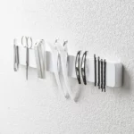 Yamazaki TOWER Magnetic Knife Rack in White, with Tweezers, Nail Scissors, and Hair Clips
