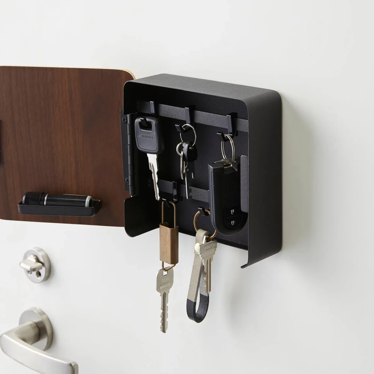 Yamazaki RIN Magnetic Key Box in Black, open, showing a car key and key rings in close-up