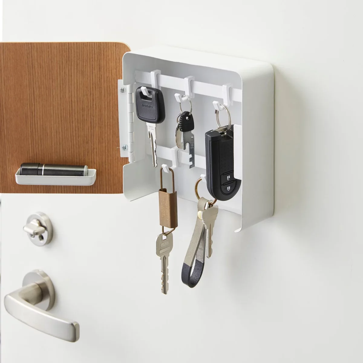 Yamazaki RIN Magnetic Key Box in White, open, showing a car key and key rings in close-up