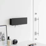 Yamazaki TOWER Wide Key Cabinet in Black, mounted on the wall in the entryway next to the closet