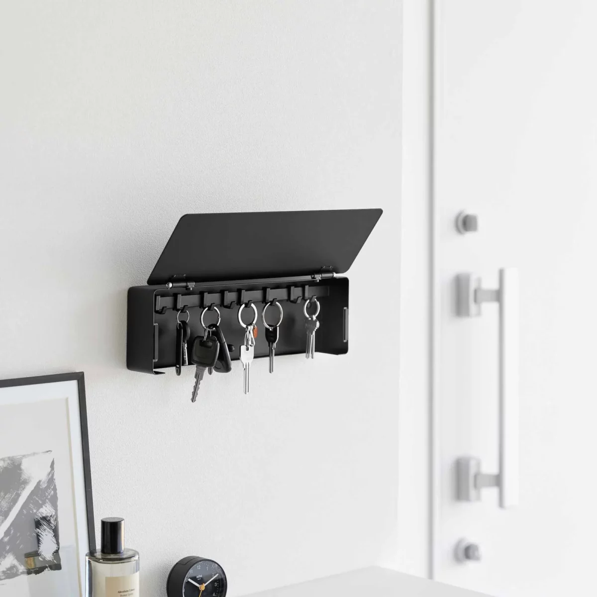 Yamazaki TOWER Wide Key Box in Black, with an open lid and keys hanging in the entryway