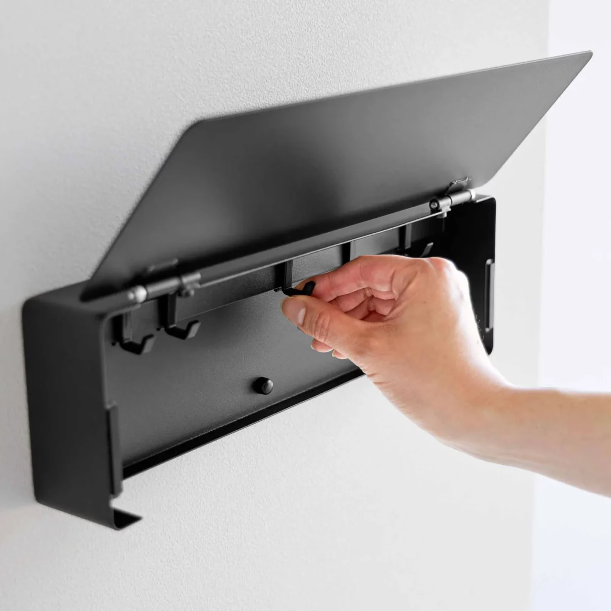 Yamazaki TOWER Wide Key Cabinet in Black; a hook slides along the inner rail