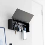 Yamazaki TOWER Wide Key Cabinet in Black, open-style with key rings and a smartphone charm, mounted on the wall