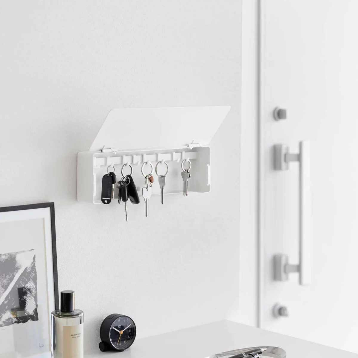 Yamazaki TOWER Wide Key Cabinet in White, with an open lid and keys hanging in the entryway
