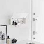 Yamazaki TOWER Wide Key Cabinet in White, with an open lid and keys hanging in the entryway