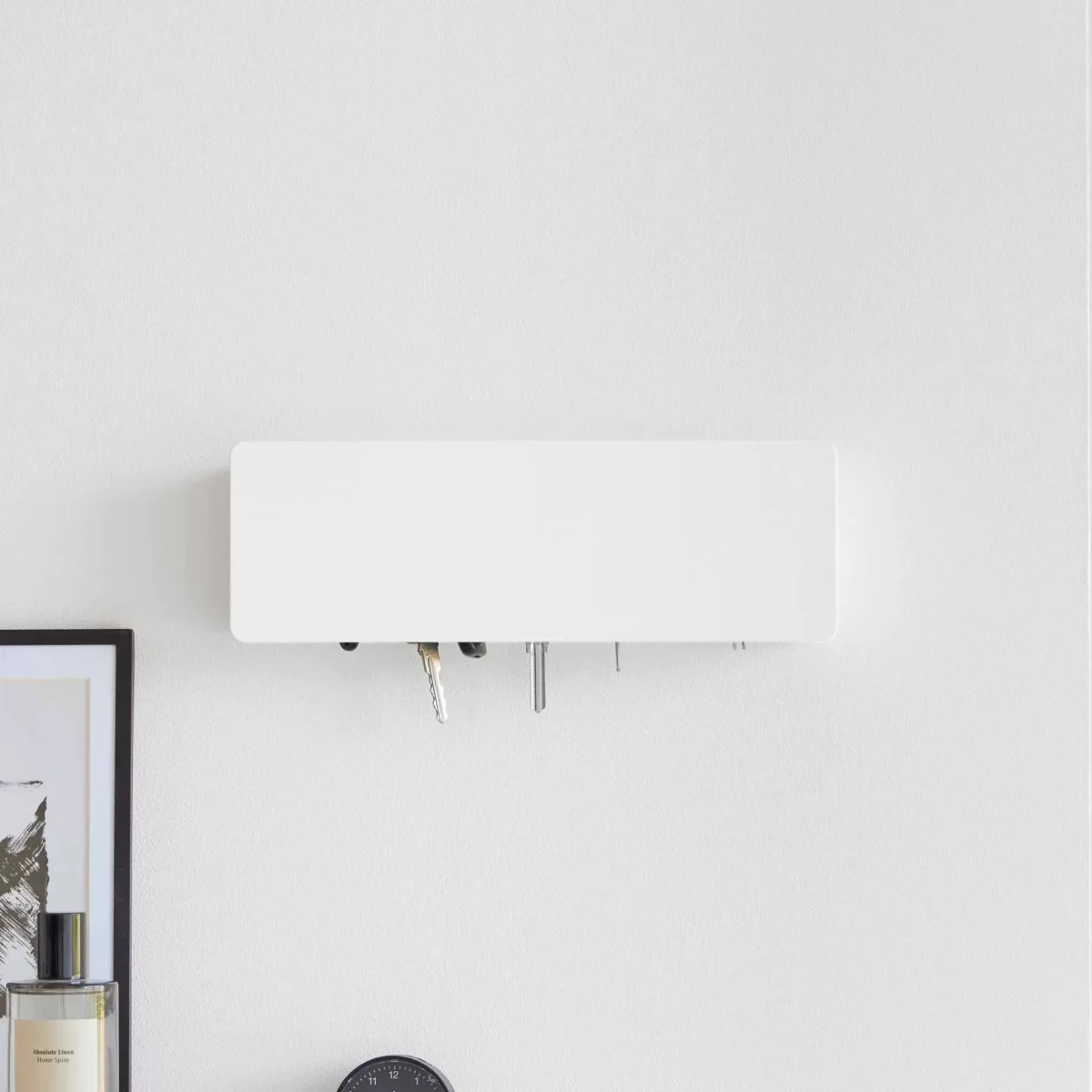 Yamazaki TOWER Wide Key Cabinet in White, placed on top of a dresser, with keys visible at the bottom