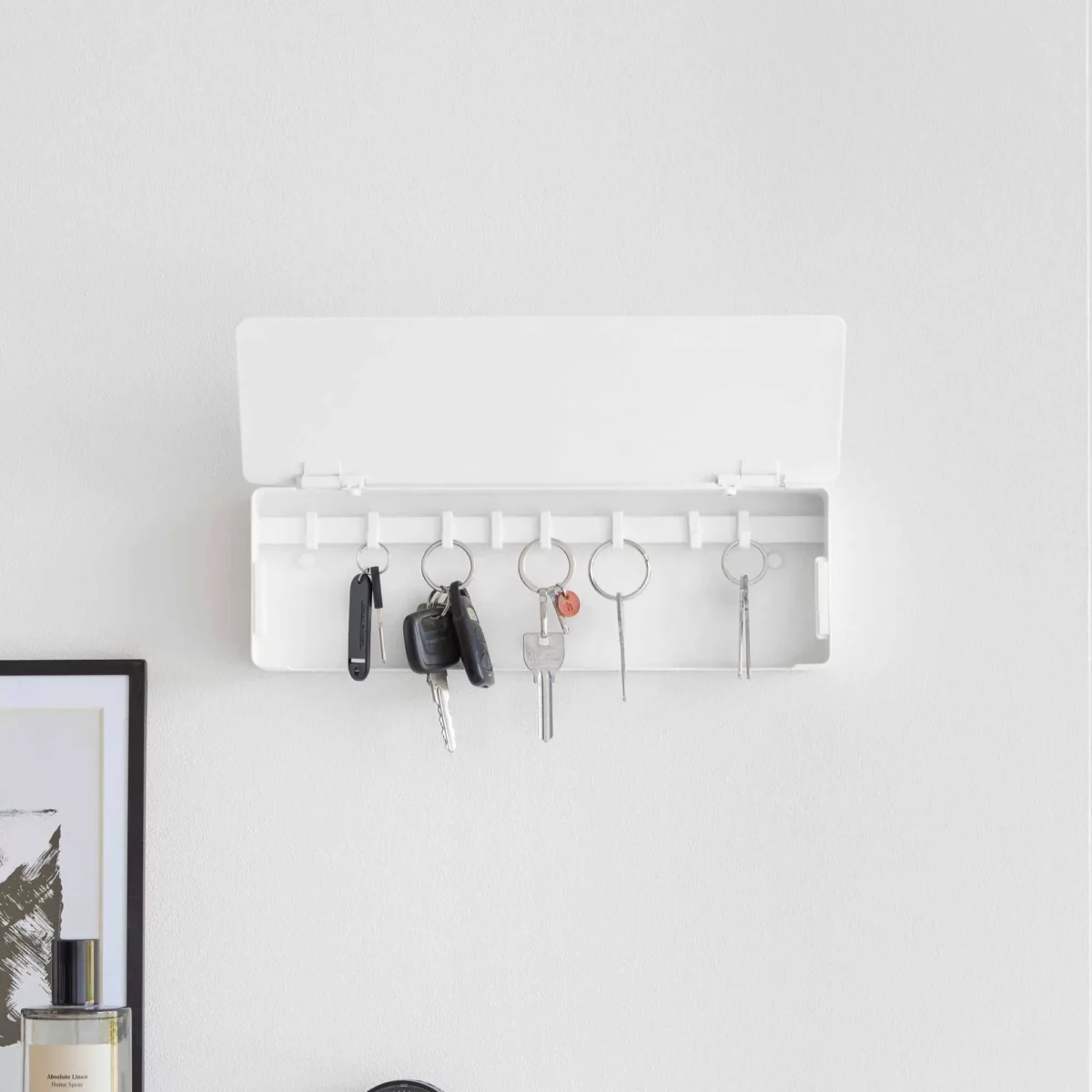 Yamazaki TOWER Wide Key Cabinet in White, shown from the front with the lid open and five key rings