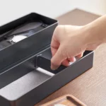 Yamazaki RIN 3-Tier Narrow Jewelry Box in Black; Hand places a divider in a compartment