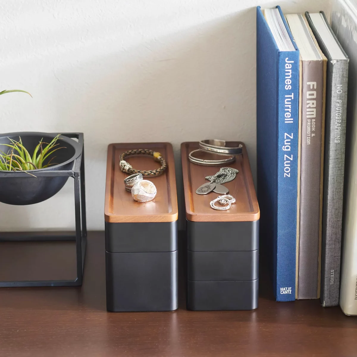 Yamazaki RIN 3-Tier Narrow Jewelry Box in Black, two boxes side by side next to books