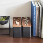 Yamazaki RIN 3-Tier Narrow Jewelry Box in Black, two boxes side by side next to books