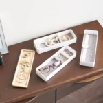 Yamazaki RIN 3-Tier Narrow Jewelry Box in White, with three compartments and a lid, each individually lined with jewelry