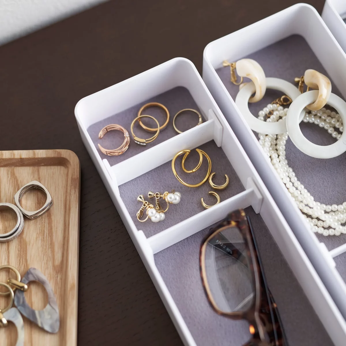 Yamazaki RIN 3-Tier Slim Jewelry Box in White, close-up of the compartments with rings and earrings