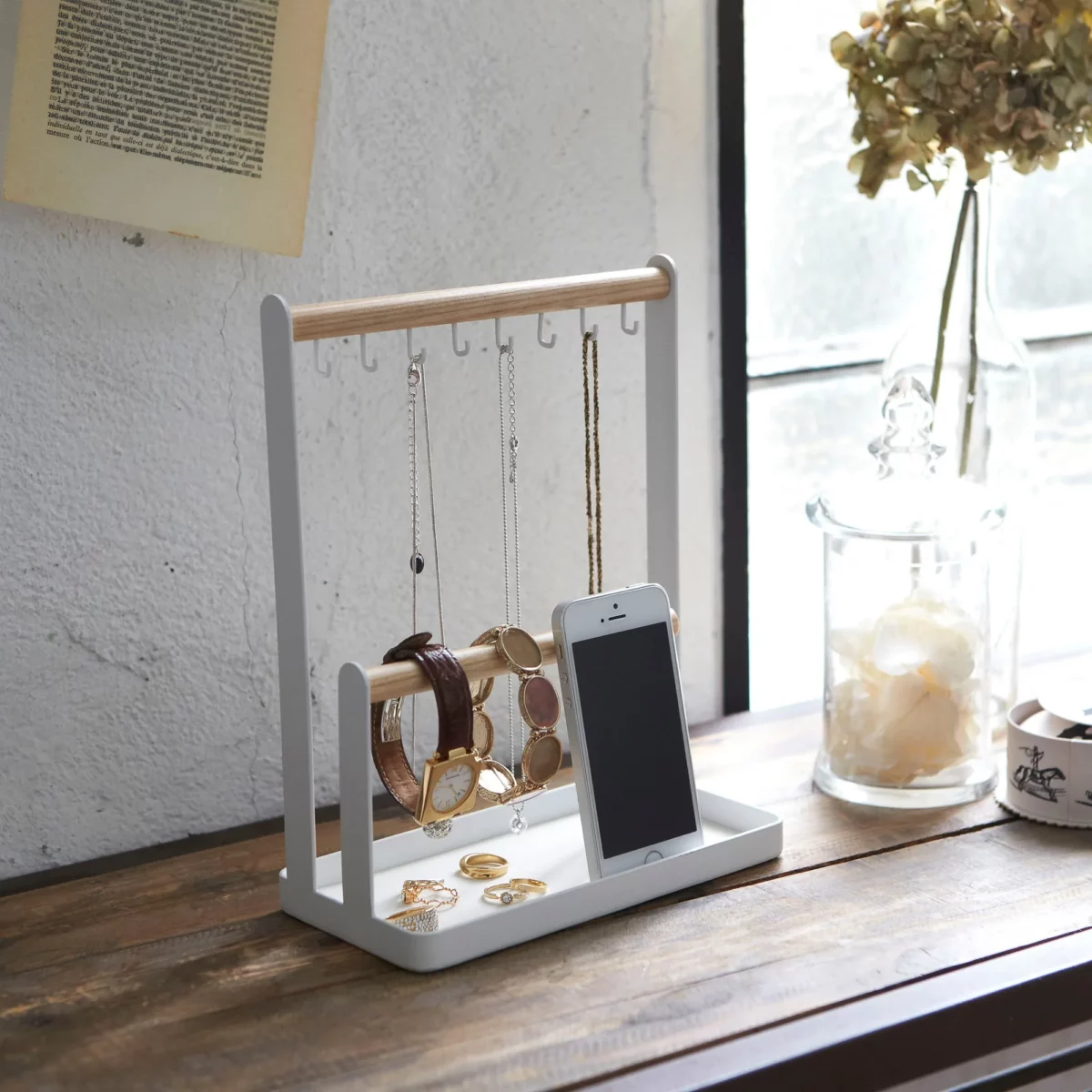 Yamazaki TOSCA Jewelry Rack with Hooks in White, designed to be mounted on the front of a window with eight hooks and rings