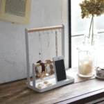 Yamazaki TOSCA Jewelry Rack with Hooks in White, designed to be mounted on the front of a window with eight hooks and rings