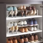 Yamazaki FRAME Shoe Rack for the shoe cabinet in white, displayed in the shoe cabinet with pumps and low-cut shoes