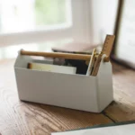 Yamazaki TOSCA Wide Pen Holder in White, on the table by the window with books