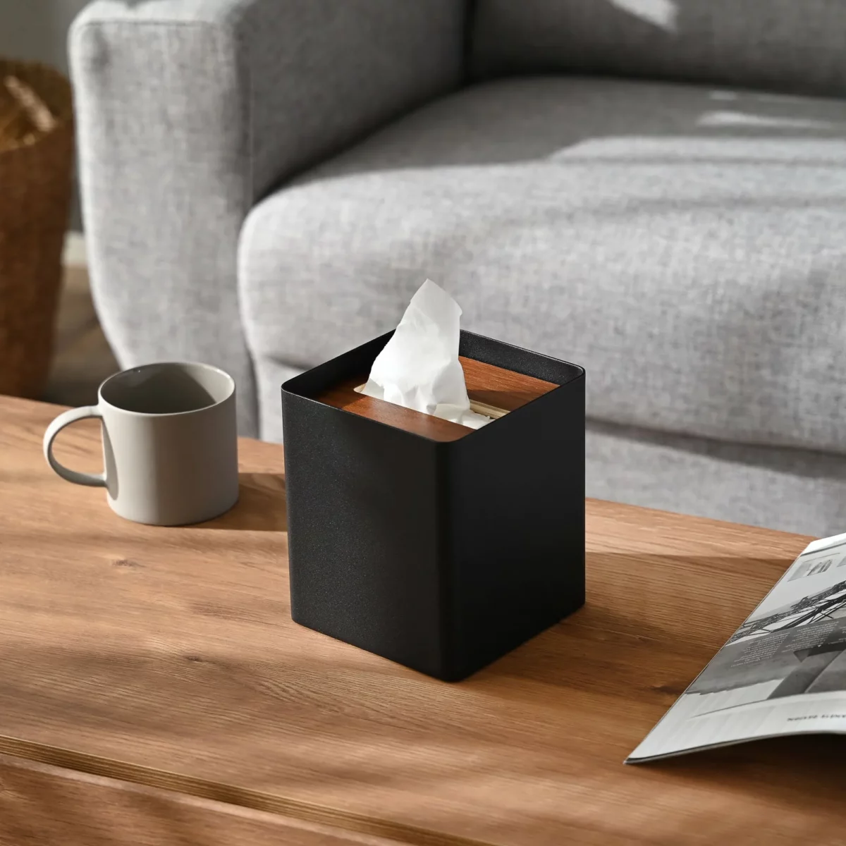 Yamazaki RIN Square Tissue Box in Black, on the side table next to the sofa and a cup