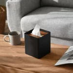 Yamazaki RIN Square Tissue Box in Black, on the side table next to the sofa and a cup