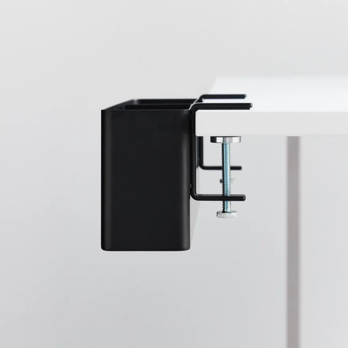 Yamazaki TOWER Narrow Table Clamp Basket in Black, close-up of the screw clamp on the table edge