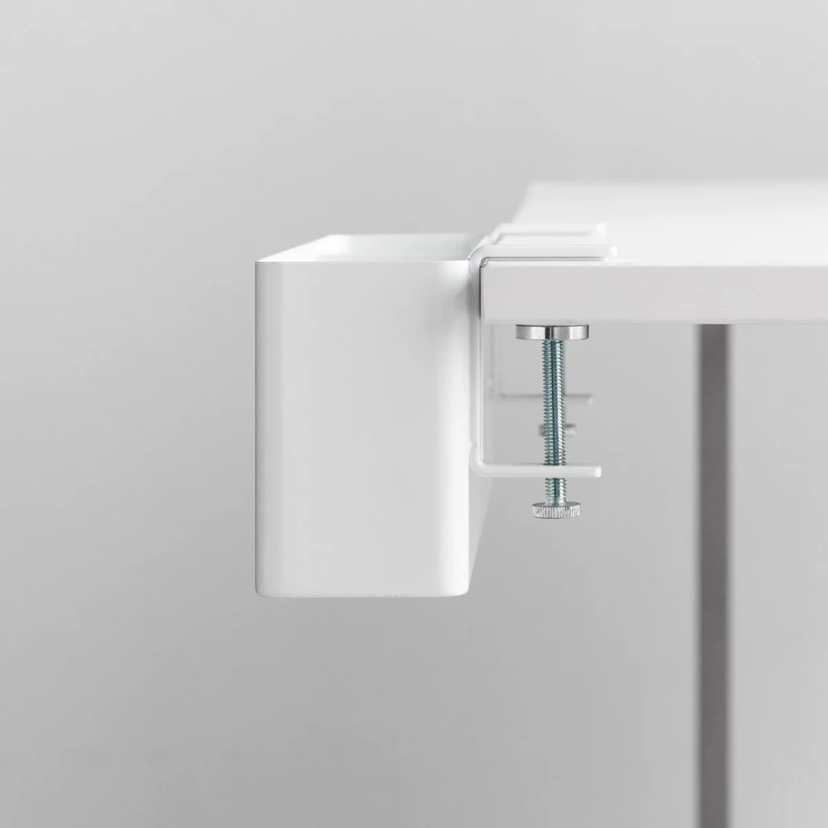 Yamazaki TOWER Narrow Table Clamp Basket in White, close-up of the screw clamp on the table edge