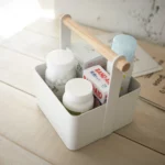 Yamazaki TOSCA Small Utensil Box in White, close-up showing cans and band-aids in the basket