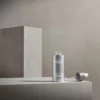 BABOR Derma Filler Serum mit herausgezogener Pipette auf grauen Steinquadern, Stimmungsbild in Grau